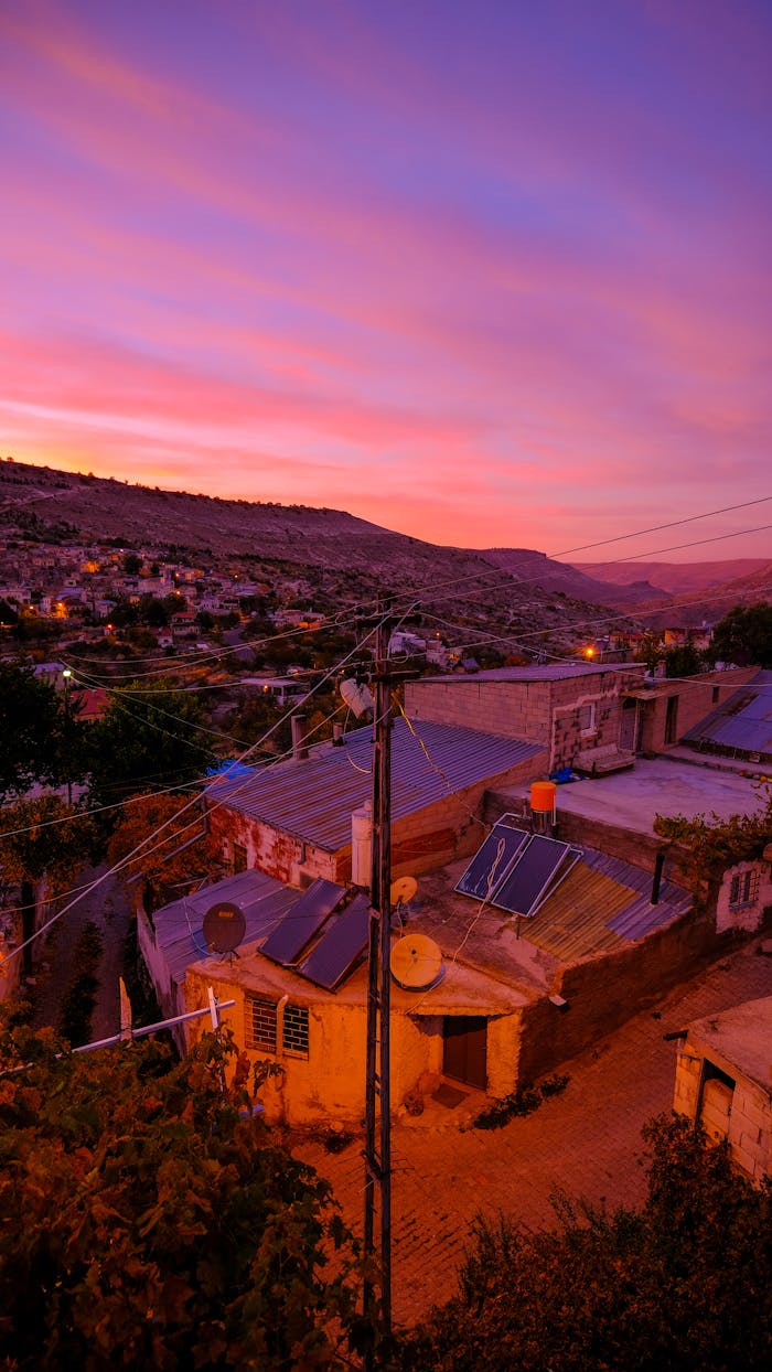 Solar Panels on House in City at Dawn